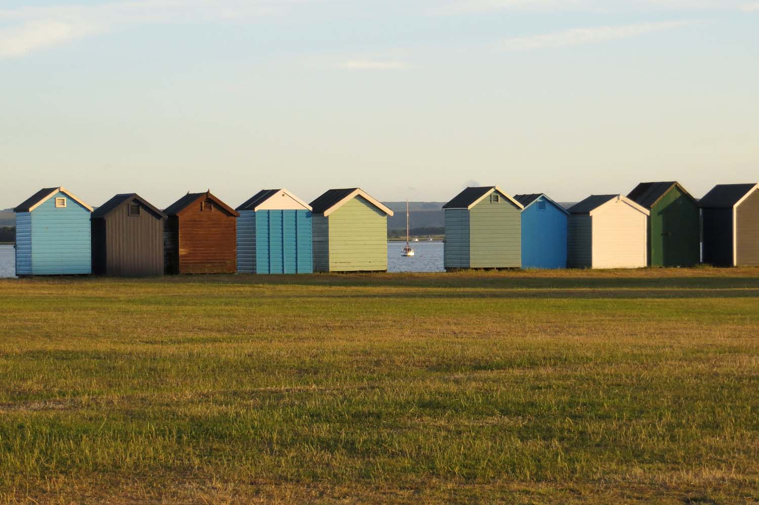 Beach huts at Hamworthy Park on the harbour shore